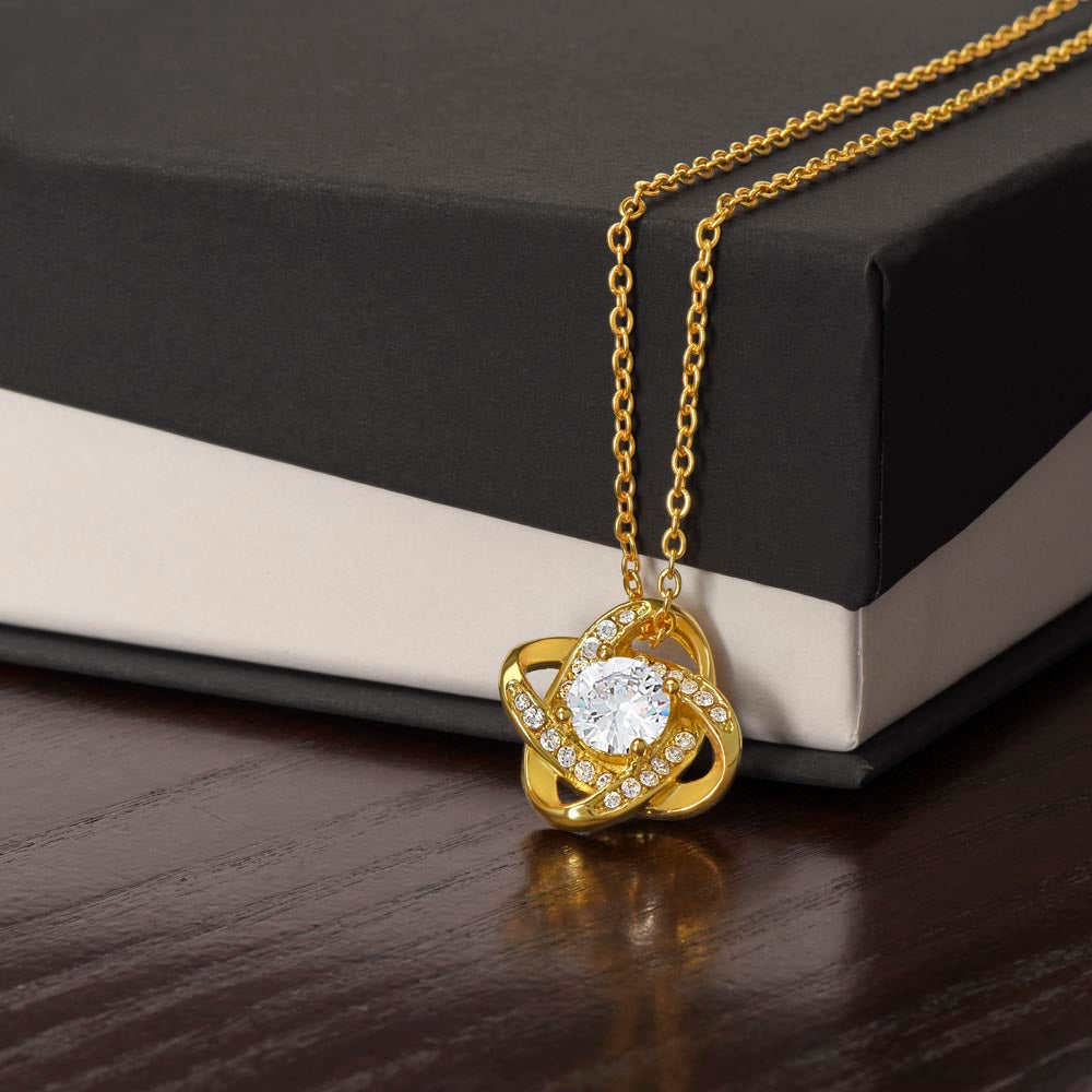 Gift Necklace To Mom: I Love You To The Moon and Back yellow gold hanging off the box on display